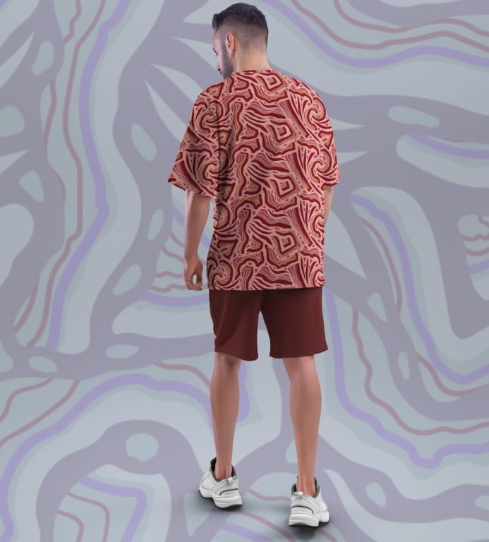 Juxar model wearing vintage oversized printed t shirt in red abstract pattern with shorts and white sneakers