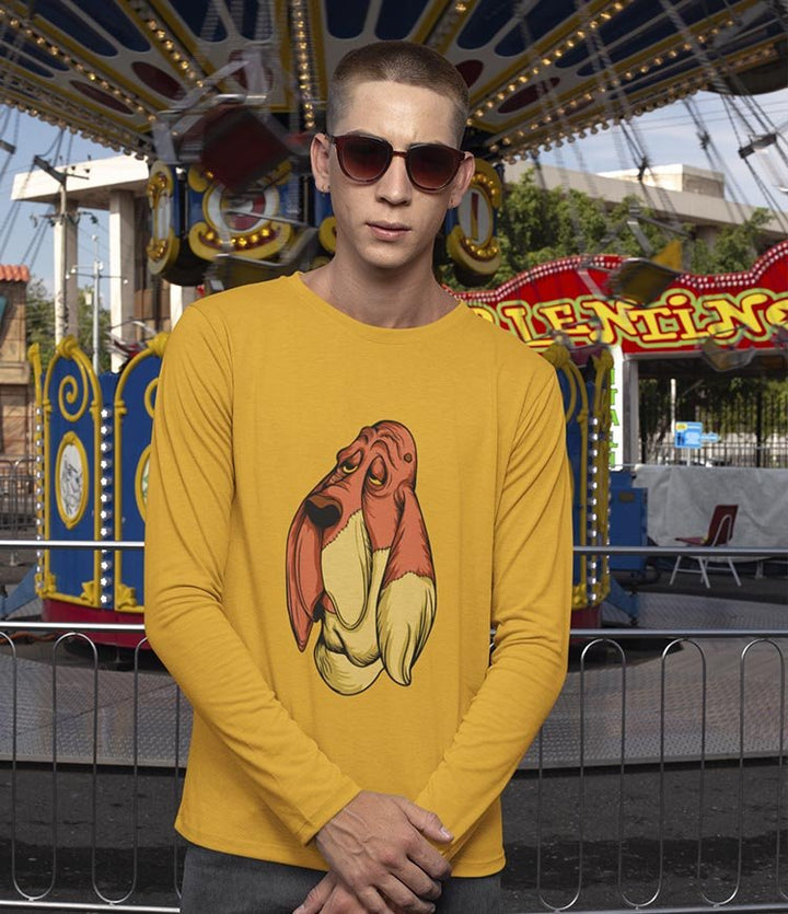 Man wearing mustard designer cotton long sleeve t shirt with droopy dog print at amusement park