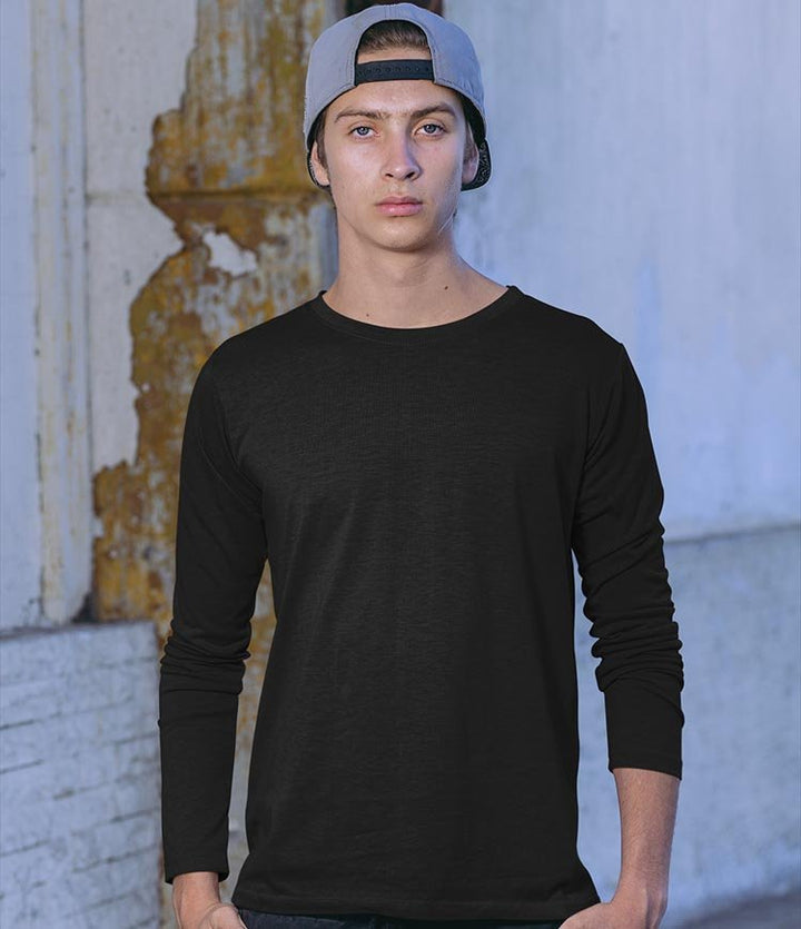 Juxar black everyday wear cotton long sleeve t shirt on male model wearing backward cap in urban setting