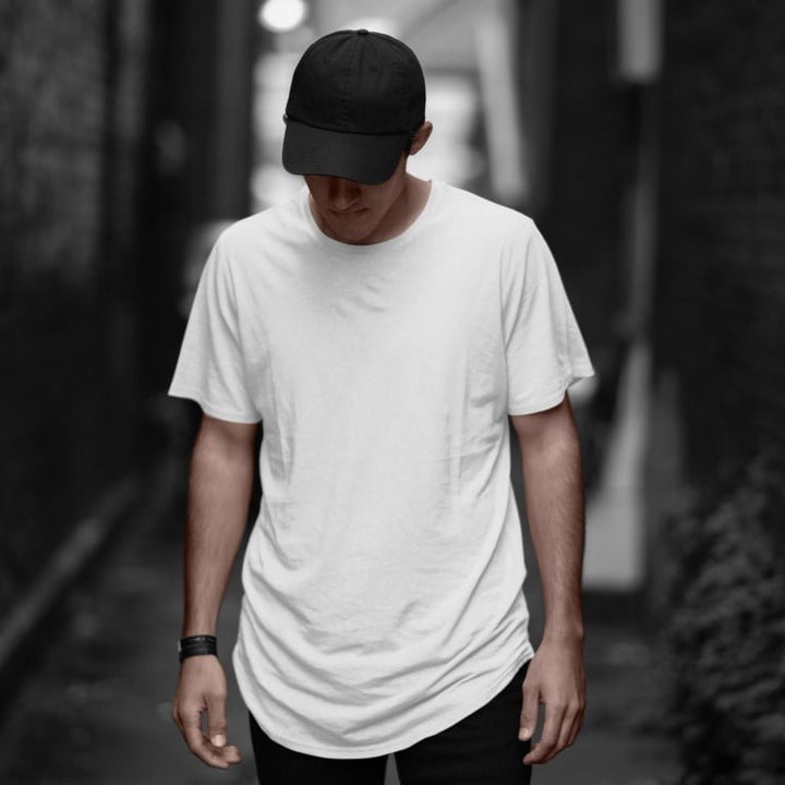 Juxar soft cotton longline tee for everyday wear white longline tee on male model with black cap