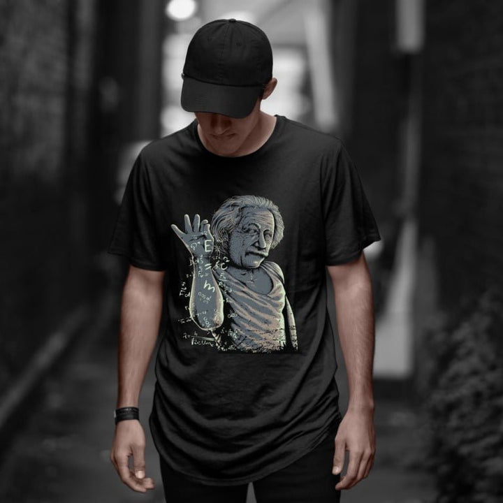 Juxar streetwear cotton longline t shirt black with Einstein graphic modeled by man in urban alley