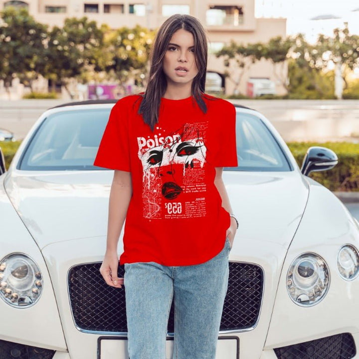 Juxar red graphic minimal boyfriend t shirt worn by model leaning on white luxury car outdoors
