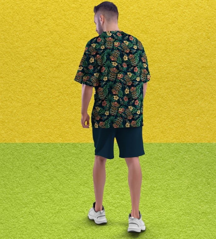 Juxar model wearing trendy full printed oversized t shirt with green tropical floral print back view