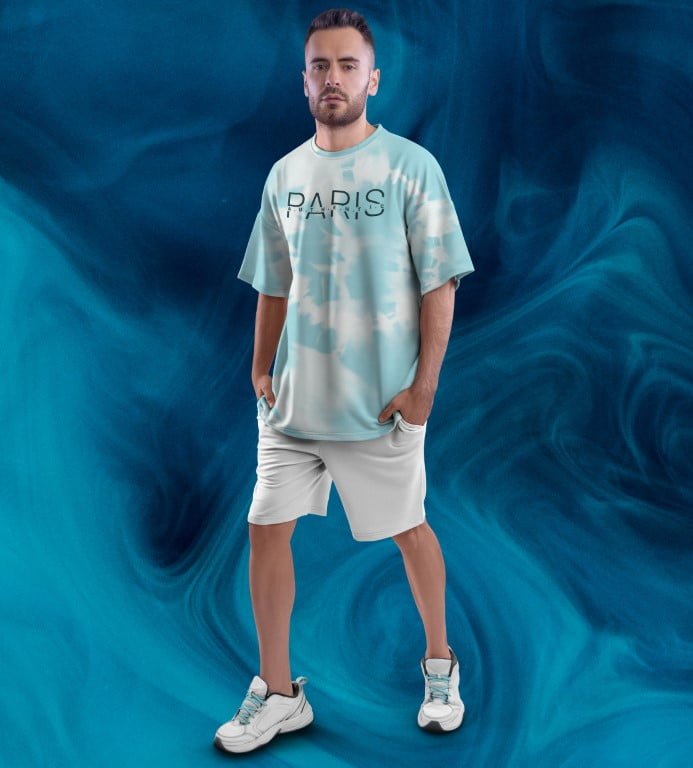 Juxar full printed oversized t shirt for men in mint tie dye with PARIS print modeled with shorts and sneakers