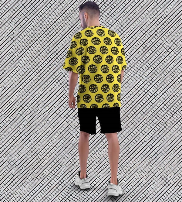 Juxar street style oversized printed t shirt yellow with black circular print back view black shorts white sneakers