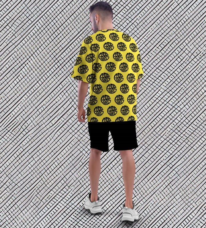 Juxar street style oversized printed t shirt yellow with black circular print back view black shorts white sneakers