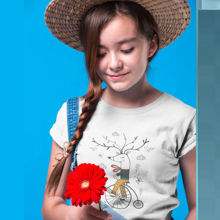 Juxar girls winter deer graphic t-shirt white with playful deer on bicycle model holding red flower and straw hat